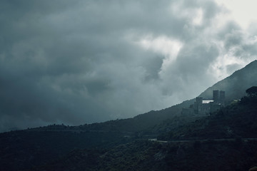 castle on hillside in clouds