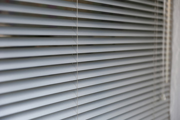 background of silvery blinds close up