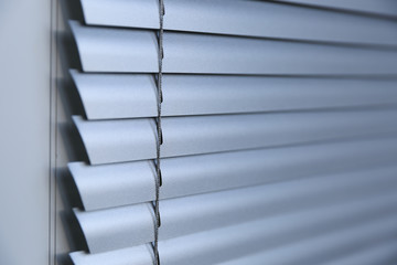 background of silvery blinds close up