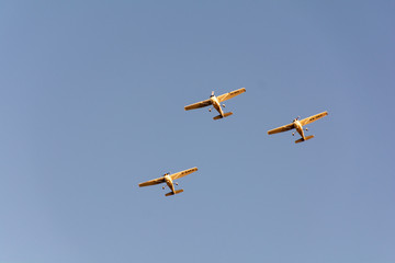 Three small planes flying in a formation