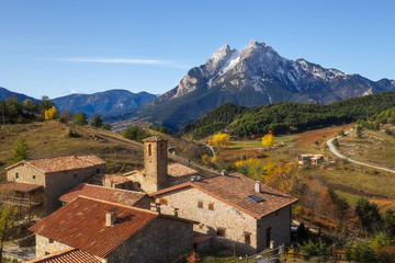 Fototapeta na wymiar Gisclareny Village and Iconic Pedraforca Mountain on the Background