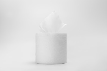 Roll of white  toilet tissue paper on isolated white background.