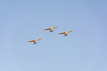 Three small planes flying in a formation