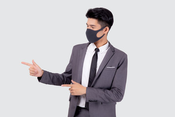 Portrait young asian businessman in suit wearing face mask for protective covid-19 isolated on white background, business man presenting and showing, quarantine for pandemic coronavirus, new normal.