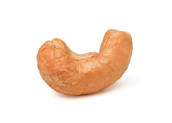 Closeup isolated of fresh roasted cashew nut seed on white background.