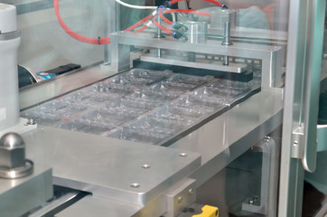 Pharmaceutical industry line for sealing ampoules in plastic packaging
