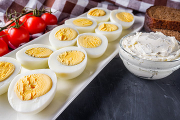 boiled chicken eggs on a dark stone background