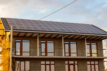 Solar panels on a roof of residential house. Photovoltaic modules for innovation alternative energy