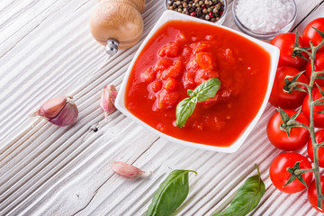 juicy canned tomatoes on wooden rustic background