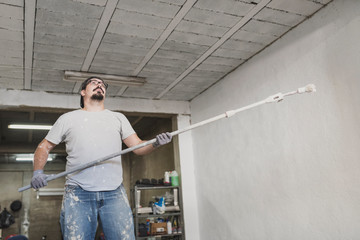 Man painting garage in realistic scene