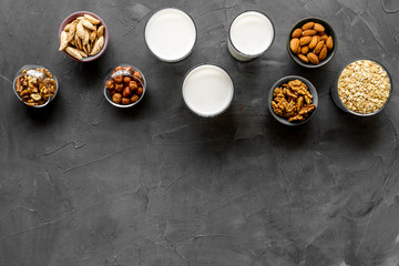 Set of non-dairy milk - almond hazelnut walnut oat. Top view, copy space