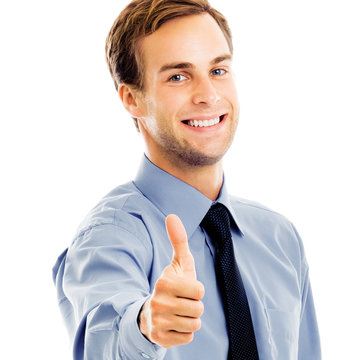Portrait image - smiling confident businessman showing thumbs up like hand sign gesture, isolated over white background. Happy confident man gesturing. Square composition.