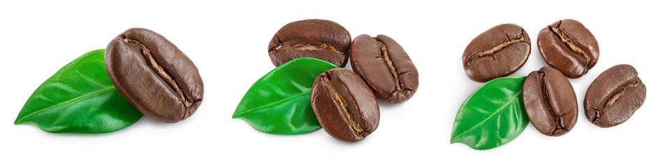 Heap of roasted coffee beans with leaves isolated on white background . Top view. Flat lay.