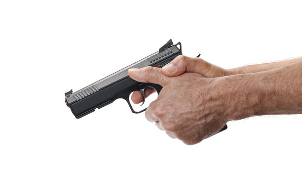 Pistol in man hands isolated on white background