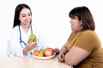 Asian attractive woman doctors, Nutritionists are recommending women patients, Which is obese, eat fruit for weight loss, skin care and health care, On white background.