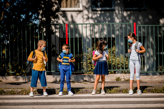 Children Going Back To School After Epidemic, They Are Wearing A Protective Face Mask