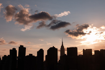 Plakat Beautiful Silhouettes of Skyscrapers in the Midtown Manhattan Skyline during a Sunset in New York City