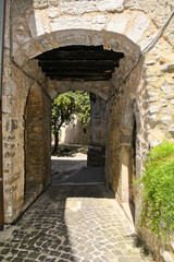 Fototapeta na wymiar A narrow street among the old houses of Vallecorsa, a medieval village in the lazio region.