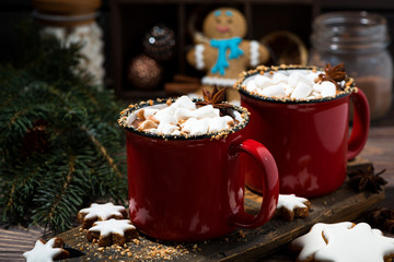 cozy winter drink hot chocolate in red mugs