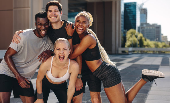 Group of sportive team of runners in the city