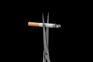 cuts a cigarette with scissors and Quit smoking.