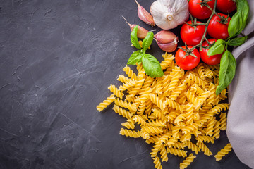 concept of traditional italian pasta with tomatoes and basil