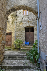A narrow street among the old houses of Lenola, a medieval village in the Lazio region.