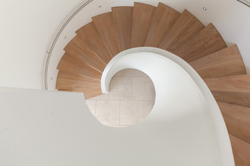 spiral wooden staircase in house.