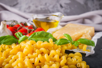 concept of traditional italian pasta with tomatoes and basil