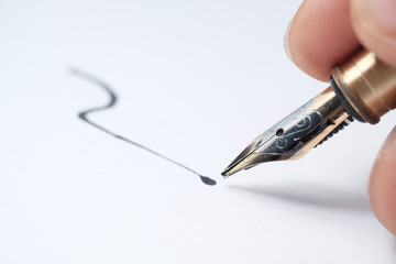 Close up of man hand writing a letter with fountain pen 