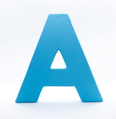 An A of blue painted wood on a white background