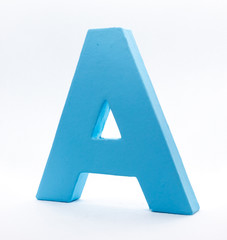 An A of blue painted wood on a white background