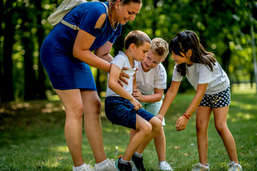 Fototapeta premium Worried boy and his school friends during physical education classes
