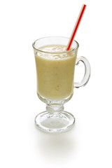 homemade banana milk smoothie isolated on white background