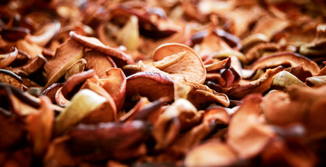 Background of dried apples on the table. Autumn fruit picking.