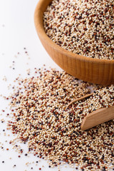 mix of quinoa grains on white acrylic background