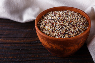 mix of quinoa grains on dark wooden rustic background