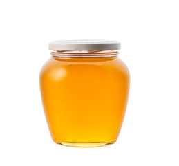 large jar of honey isolated on white background.