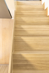 Fototapeta na wymiar Background wooden staircase made from laminate wood