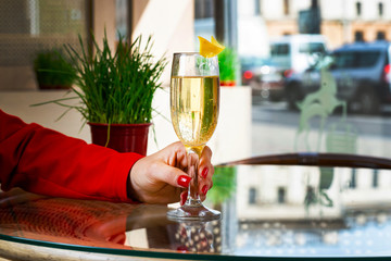 lonely girl drinking champagne, hand close-up