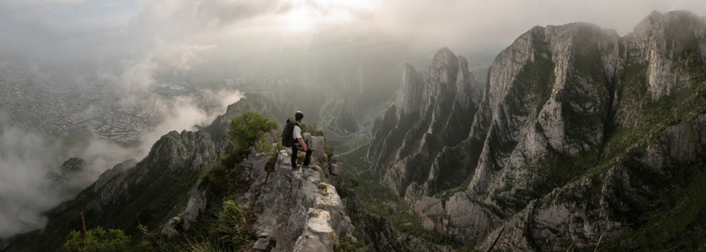 One man standing on a narrow edge at a high area in La Huasteca