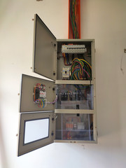 SELANGOR, MALAYSIA -AUGUST 19, 2020: Electrical distribution board in the installation process. Electrical wireman will install this equipment according to the electrical engineer design.