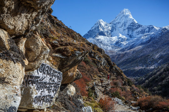Buddhist script below the peak of Ama Dablam on the trail to Everest.