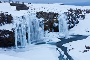 kirkjufellsfoss waterfall in winter iceland