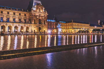 Obraz premium The Louvre architecture in Paris, long exposure