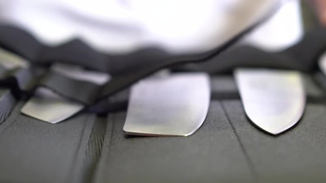 Chef selecting cooking knife from set, close up truck shot