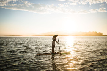 paddle boarding at sunset 