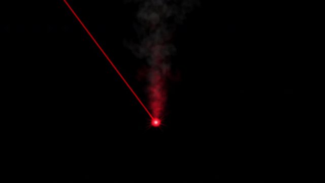 Red laser beam on dark background. 4K computer animation.