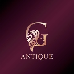 Obraz premium Antique G Letter Initial Logo Elegance Gold Rose Luxury Ornate Deco Swirl Shape Design.