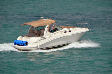 High-end cabin cruiser on the Florida Intra-Coastal Waterway off of Miami Beach.